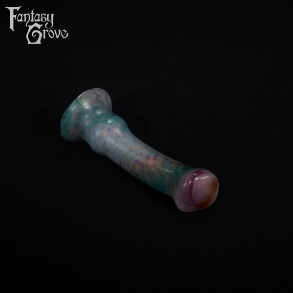 A fantasy sex toy on a black background with the Fantasy Grove logo in the upper left corner