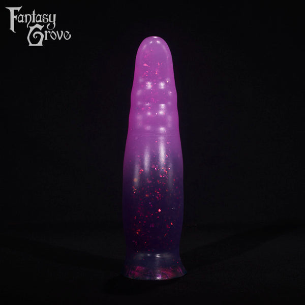 A fantasy sex toy on a black background with the Fantasy Grove logo in the upper left corner