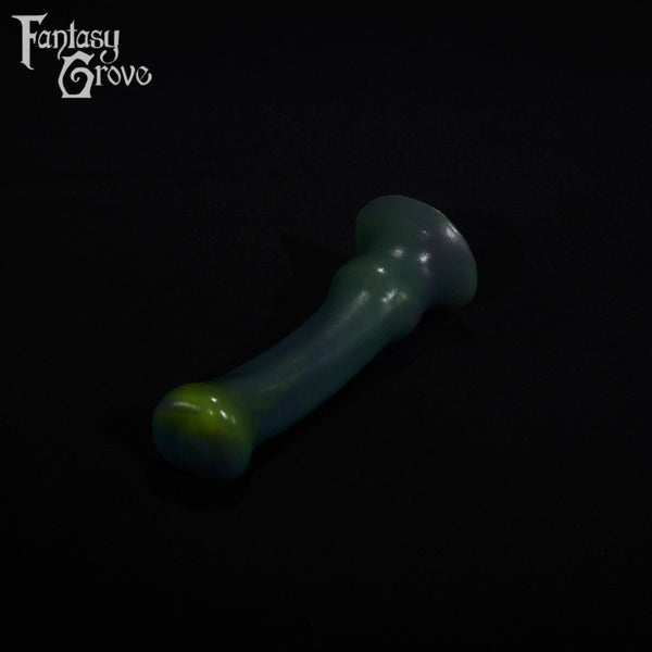 A fantasy sex toy on a black background with the Fantasy Grove logo in the upper left corner
