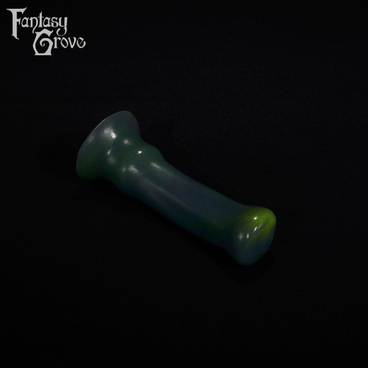 A fantasy sex toy on a black background with the Fantasy Grove logo in the upper left corner
