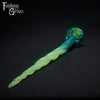 A Fantasy Grove sex toy on a black background with a logo in the upper left corner
