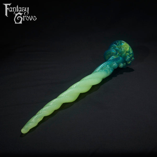 A Fantasy Grove sex toy on a black background with a logo in the upper left corner