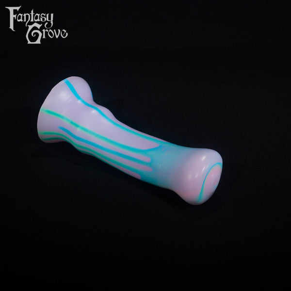 A fantasy sex toy on a black background with the Fantasy Grove logo in the upper left corner