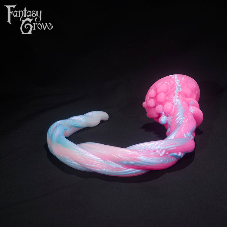 A Fantasy Grove sex toy on a black background with a logo in the upper left corner