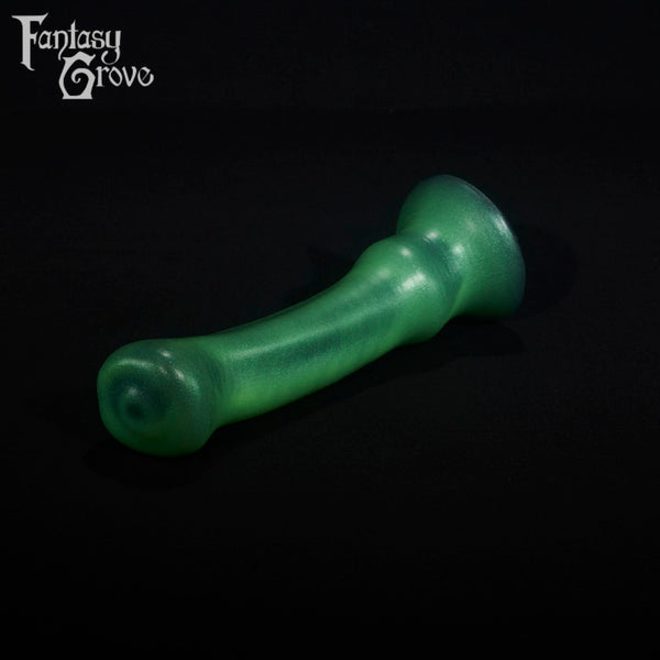 A fantasy sex toy on a black background with the Fantasy Grove logo in the upper left corner