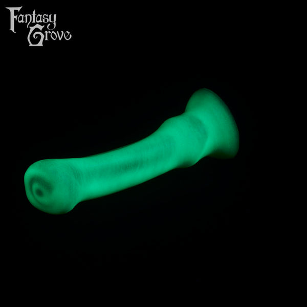 A fantasy sex toy on a black background with the Fantasy Grove logo in the upper left corner