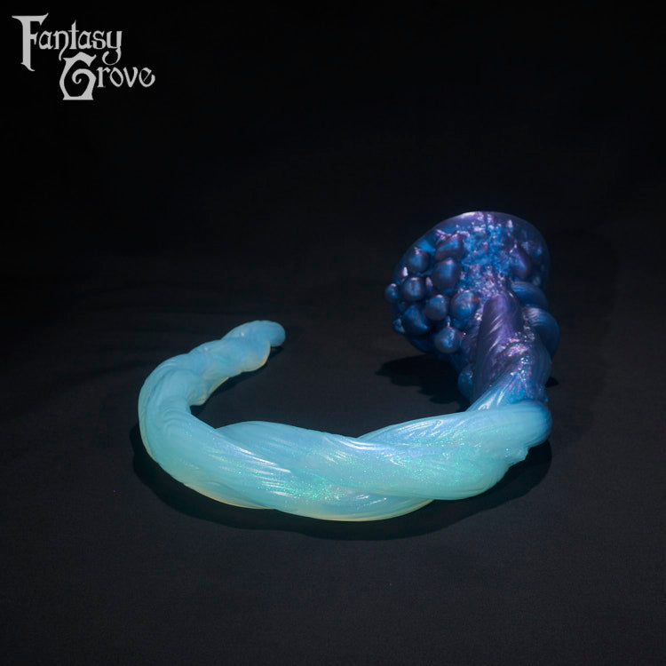 A Fantasy Grove sex toy on a black background with a logo in the upper left corner