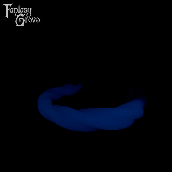 A Fantasy Grove sex toy on a black background with a logo in the upper left corner