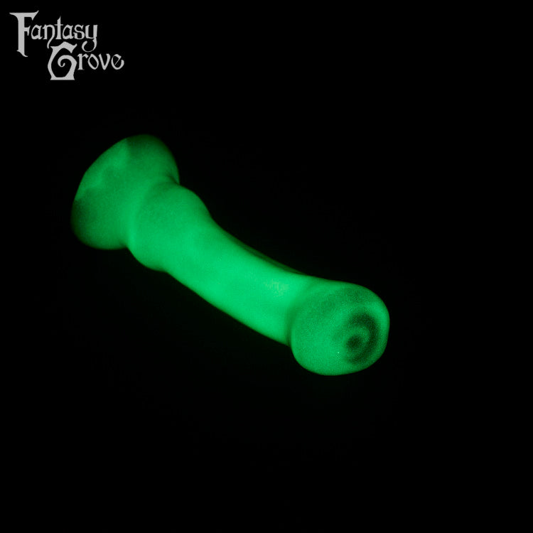 A fantasy sex toy on a black background with the Fantasy Grove logo in the upper left corner