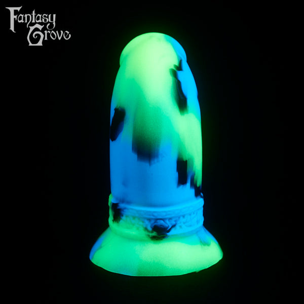 A fantasy sex toy on a black background with the Fantasy Grove logo in the upper left corner