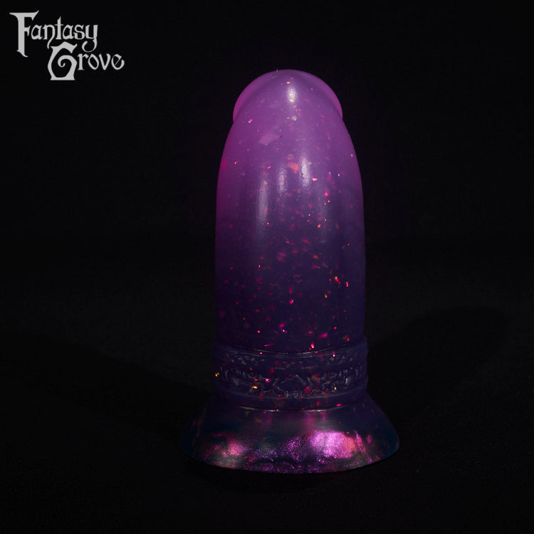A fantasy sex toy on a black background with the Fantasy Grove logo in the upper left corner