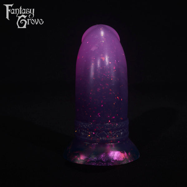 A fantasy sex toy on a black background with the Fantasy Grove logo in the upper left corner