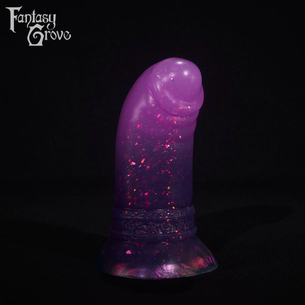 A fantasy sex toy on a black background with the Fantasy Grove logo in the upper left corner