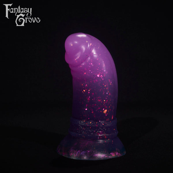 A fantasy sex toy on a black background with the Fantasy Grove logo in the upper left corner