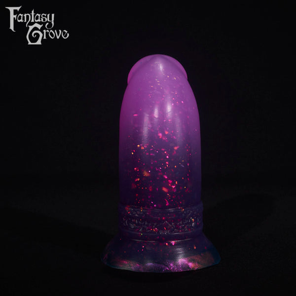 A fantasy sex toy on a black background with the Fantasy Grove logo in the upper left corner