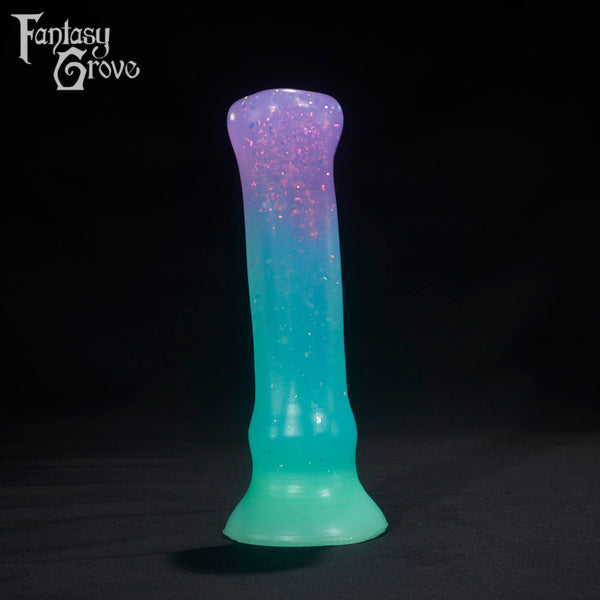 A Fantasy Grove sex toy on a black background with a logo in the upper left corner