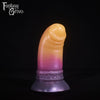 A fantasy sex toy on a black background with the Fantasy Grove logo in the upper left corner