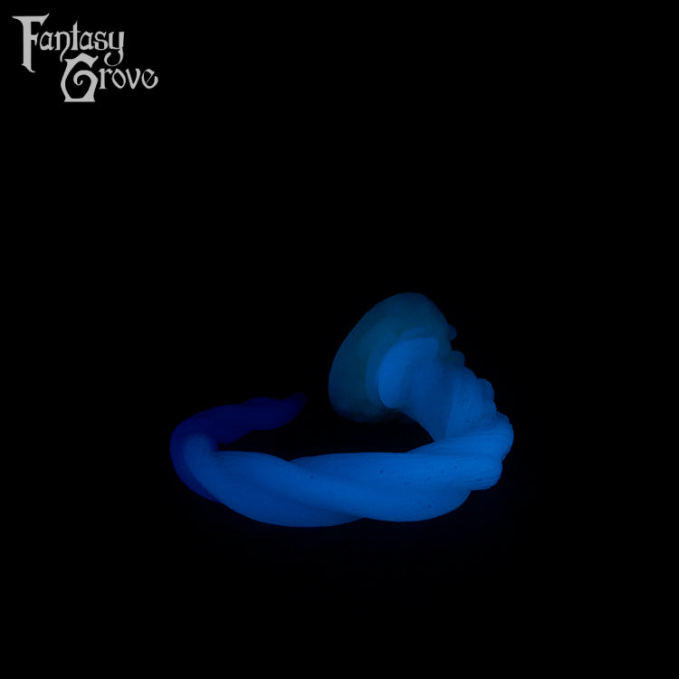 A Fantasy Grove sex toy on a black background with a logo in the upper left corner