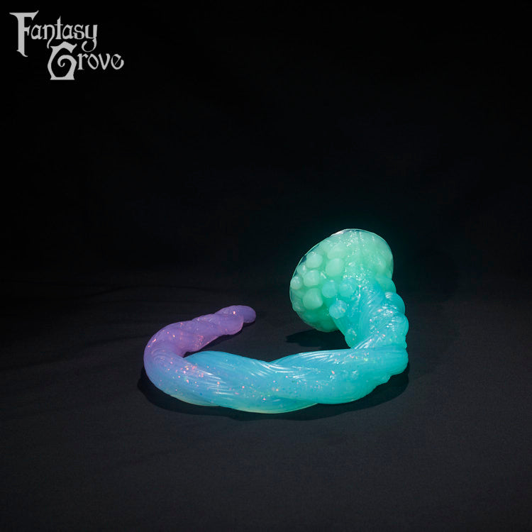 A Fantasy Grove sex toy on a black background with a logo in the upper left corner