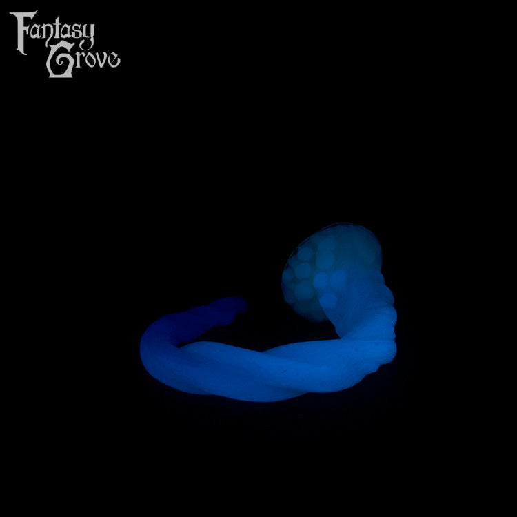 A Fantasy Grove sex toy on a black background with a logo in the upper left corner