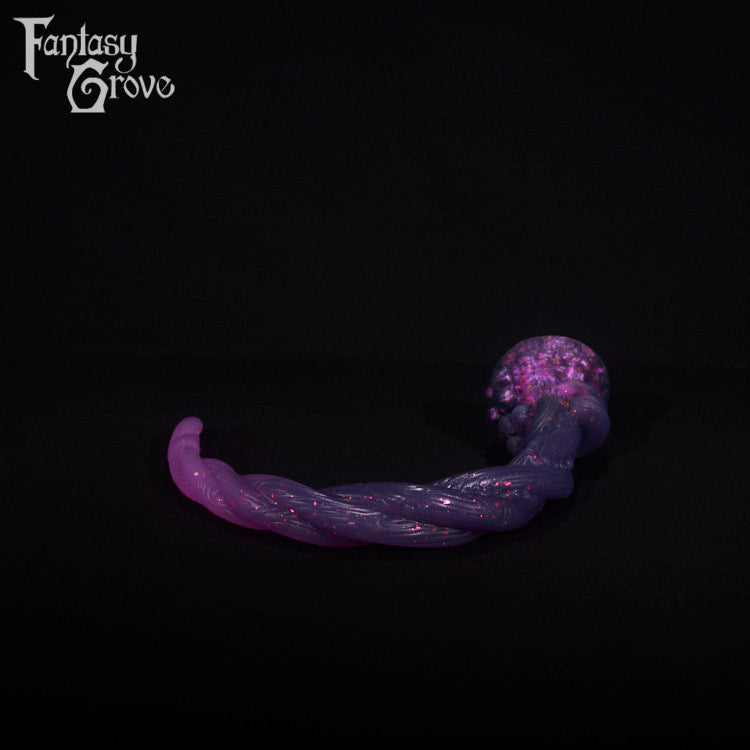 A fantasy sex toy on a black background with the Fantasy Grove logo in the upper left corner
