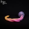 A fantasy sex toy on a black background with the Fantasy Grove logo in the upper left corner
