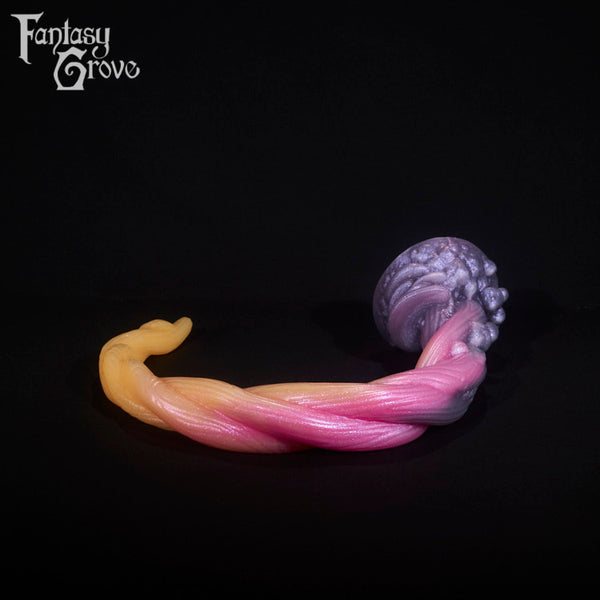 A fantasy sex toy on a black background with the Fantasy Grove logo in the upper left corner