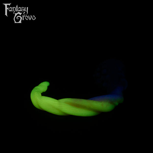 A fantasy sex toy on a black background with the Fantasy Grove logo in the upper left corner