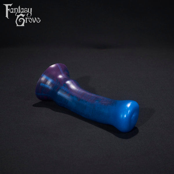A fantasy sex toy on a black background with the Fantasy Grove logo in the upper left corner 