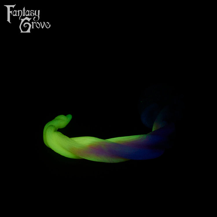 A fantasy sex toy on a black background with the Fantasy Grove logo in the upper left corner