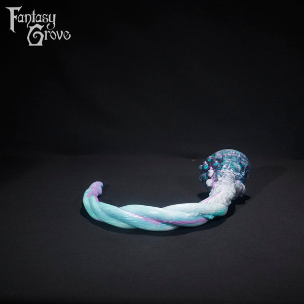 A fantasy sex toy on a black background with the Fantasy Grove logo in the upper left corner 